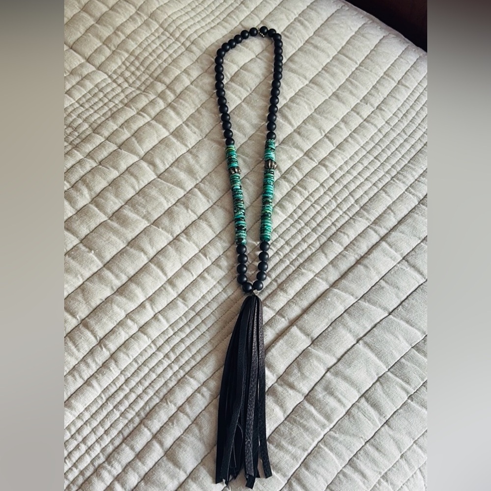 Gorgeous black and turquoise necklace with leather tassel